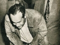 Harry Washburn ducks photographers at the courthouse building in San Angelo